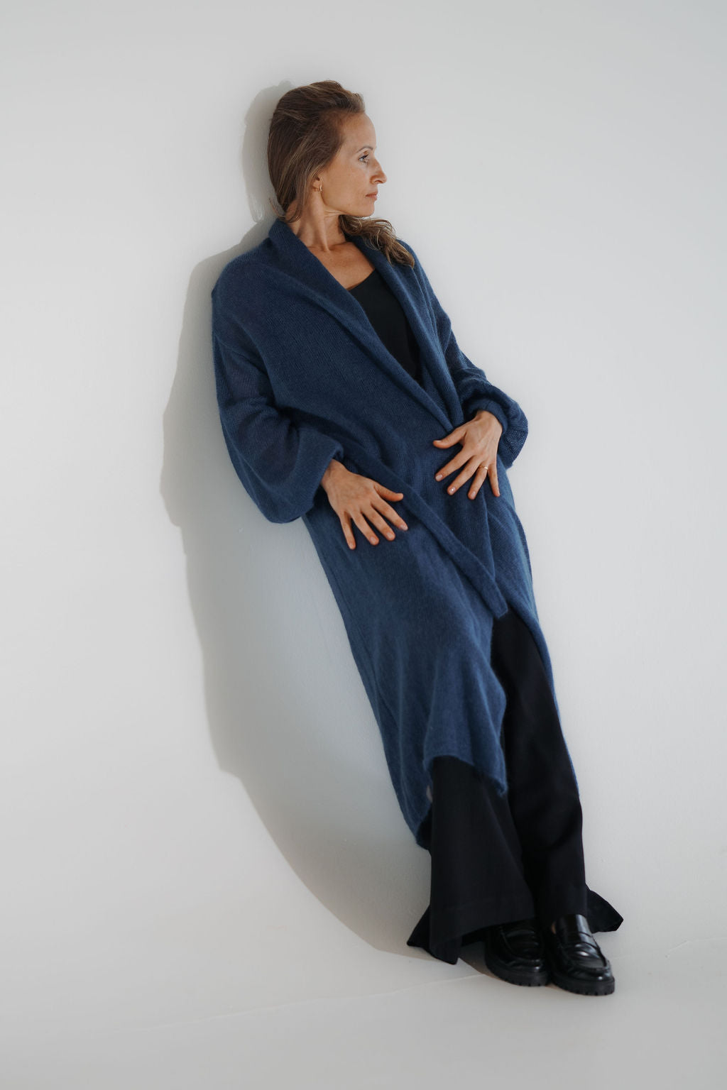 Women’s blue mohair long cardigan with puff sleeves and a belt at the waist