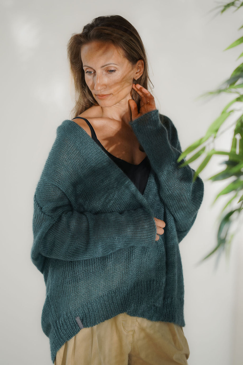 Women's teal mohair cardigan with relaxed fit