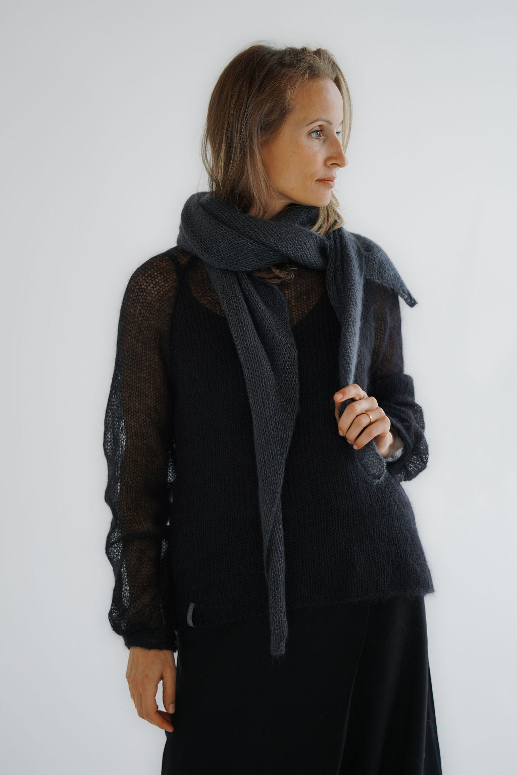 Women’s kid mohair and silk triangle scarf wrapped around the neck